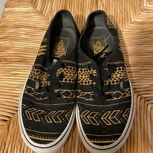 Gold and black Vans